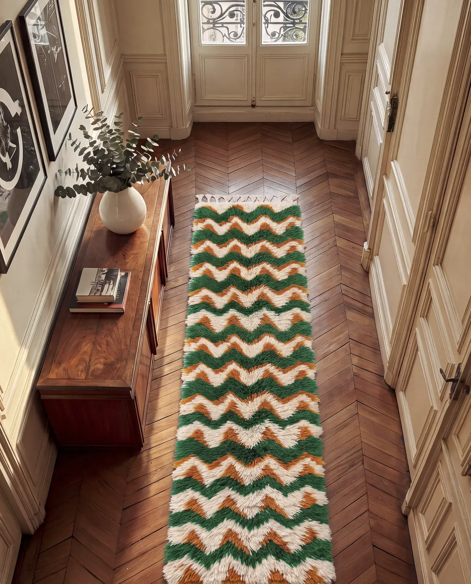 Aman Forest Green & Orange hand-tied Moroccan runner along a hallway on herringbone floors, leading to glass doors