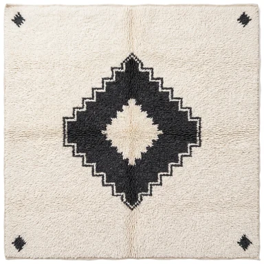 Charcoal stepped-diamond medallion on ivory hand-knotted wool