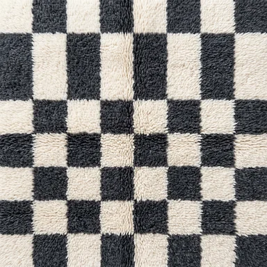 Ivory and charcoal checkered hand-knotted wool pattern