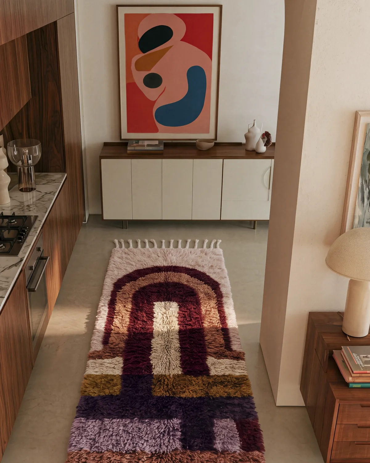 Legzira Ivory & Burgundy hand-knotted Moroccan rug, runner, in a kitchen beside white cabinetry