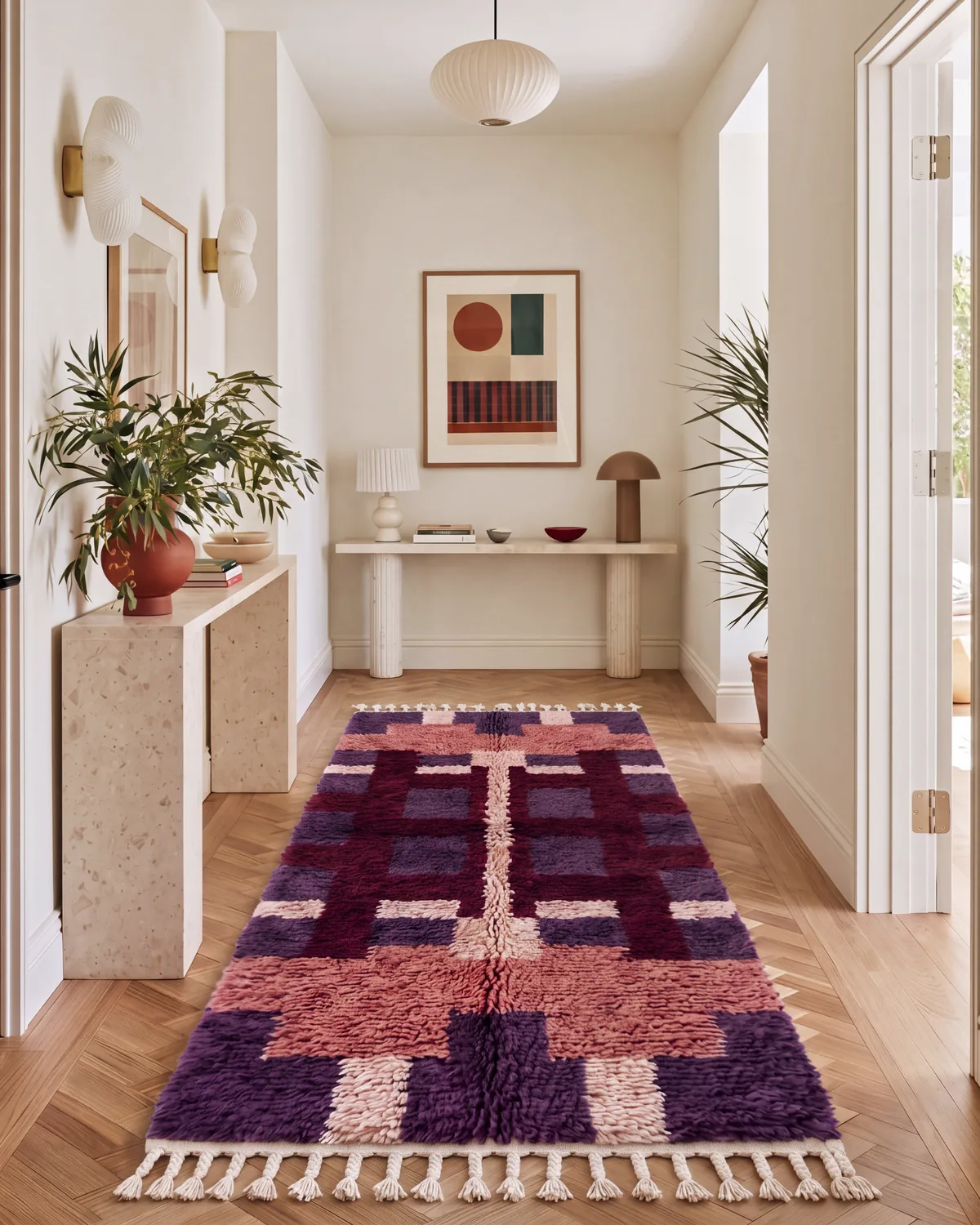 Tigmi Purple hand-knotted Moroccan rug, runner, along a hallway beside a marble console table