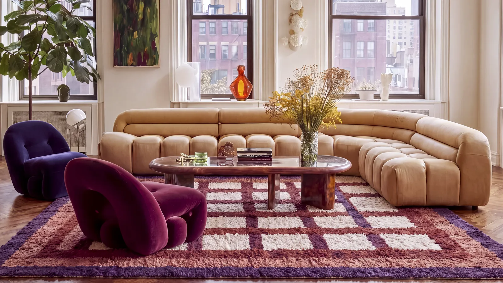 Tigmi Purple & Brown hand-knotted Berber rug, a windowpane grid, in a living room with a curved sofa