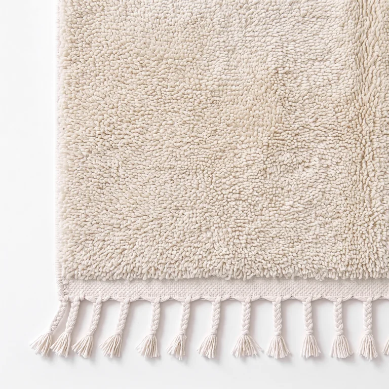Classic and runner rug edge with natural wool tassels