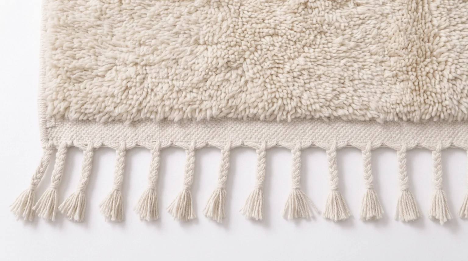 Classic and runner rug edge with natural wool tassels